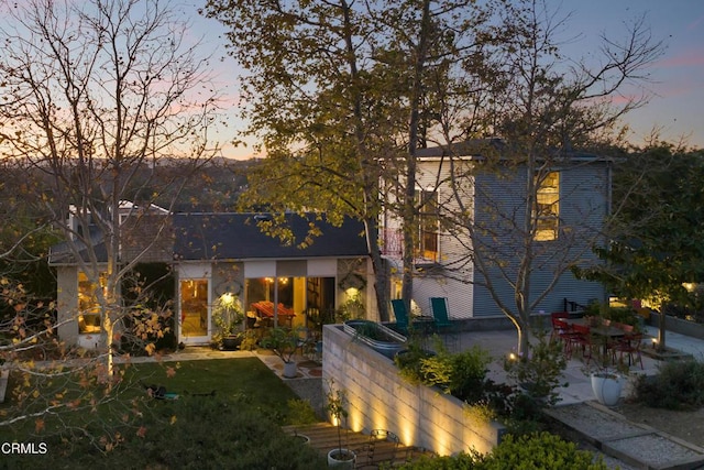 view of front of property featuring a patio