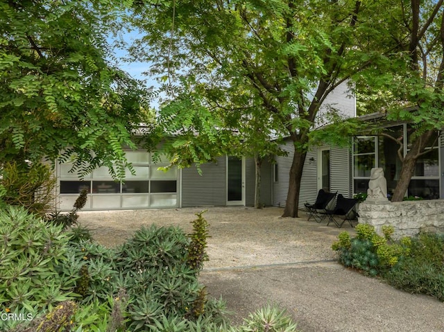 back of house with a patio area