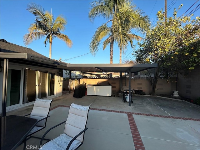 view of patio / terrace featuring fence