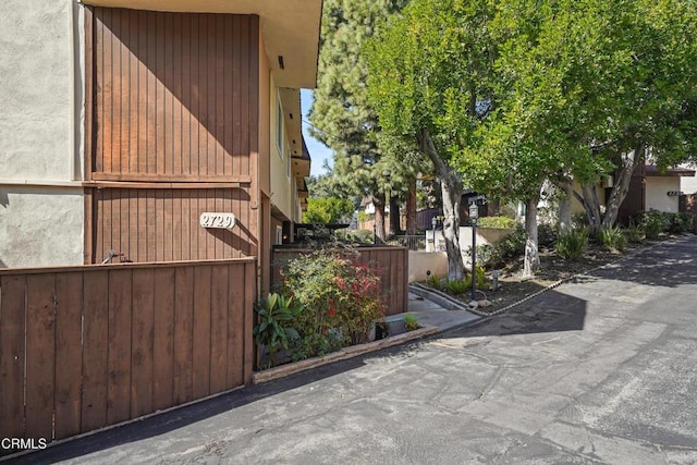 view of property exterior featuring fence