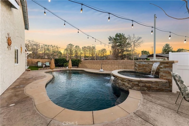 view of pool with a fenced in pool, a fenced backyard, a jacuzzi, and a patio