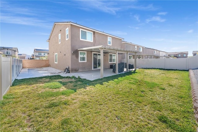 rear view of house featuring a fenced backyard, a yard, stucco siding, a pergola, and a patio area