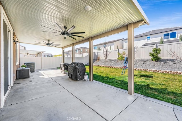 view of patio with a fenced backyard and a ceiling fan