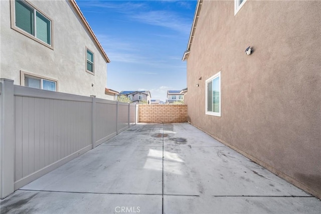 view of patio / terrace featuring fence