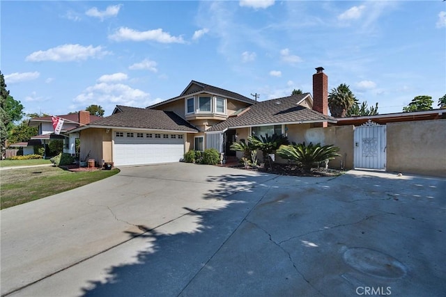 view of front of home with a garage, driveway, a chimney, and stucco siding