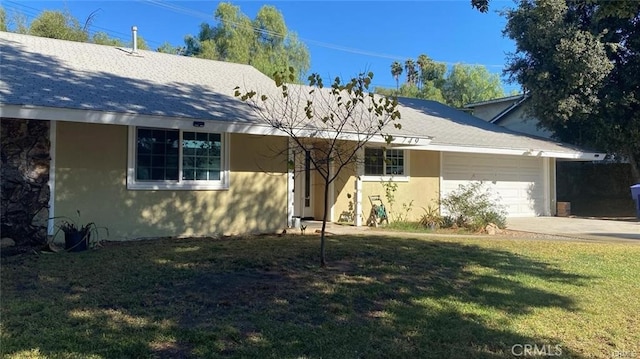 single story home featuring a garage, driveway, roof with shingles, a front yard, and stucco siding