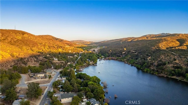 bird's eye view with a water and mountain view