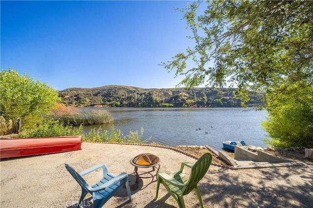 water view with an outdoor fire pit