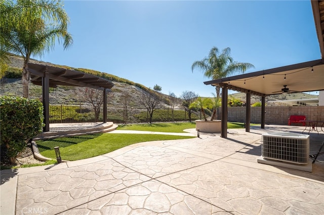 exterior space featuring a fenced backyard, a lawn, and a patio