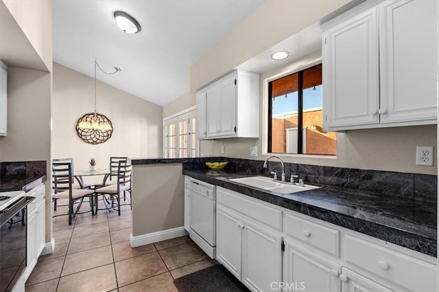 kitchen featuring white dishwasher, light tile patterned flooring, range with electric stovetop, a sink, and white cabinets