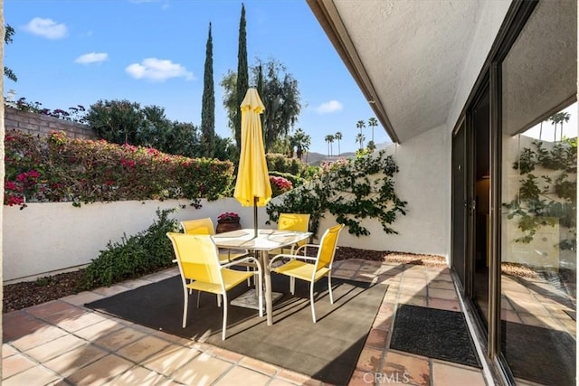 view of patio featuring outdoor dining space