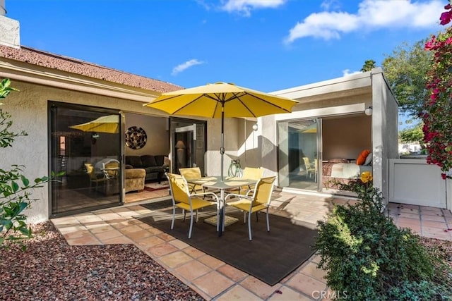 view of patio featuring outdoor dining area