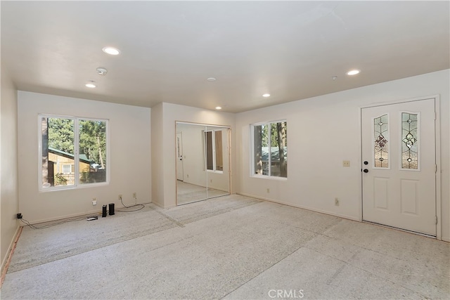 unfurnished room featuring baseboards and recessed lighting