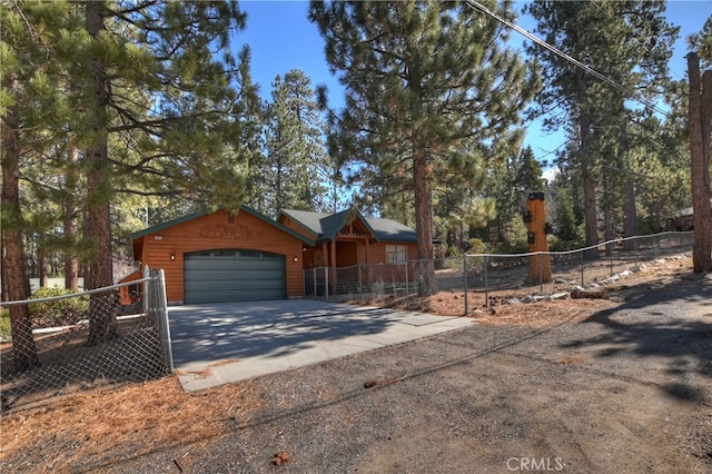 rustic home featuring a garage and fence