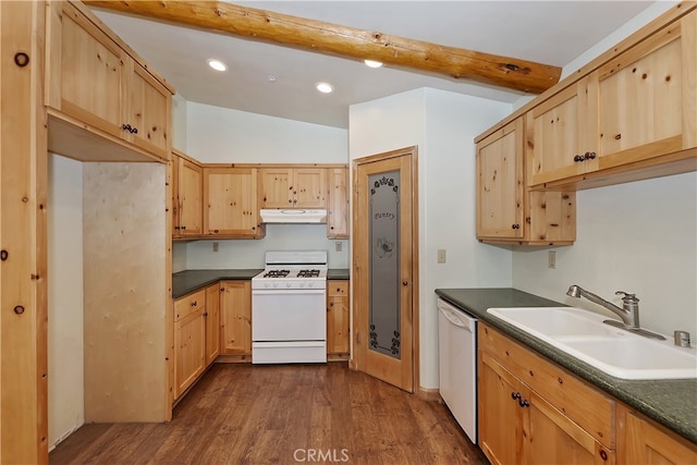 kitchen with white appliances, dark countertops, dark wood-type flooring, under cabinet range hood, and a sink