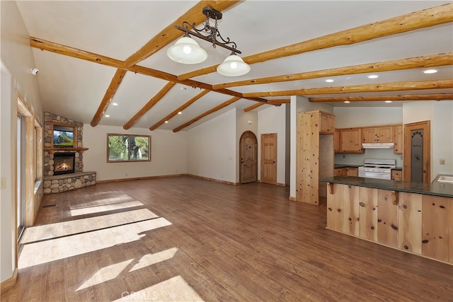 unfurnished living room featuring vaulted ceiling with beams, dark wood-style floors, baseboards, and a stone fireplace