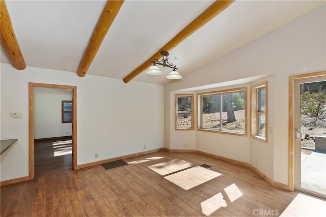 unfurnished room with lofted ceiling with beams, baseboards, visible vents, and light wood-style floors