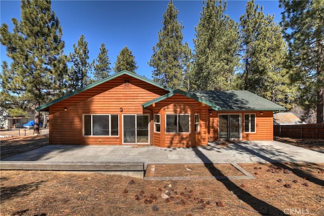 back of house featuring a patio and fence