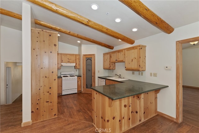 kitchen featuring dark countertops, light brown cabinetry, a peninsula, white appliances, and under cabinet range hood