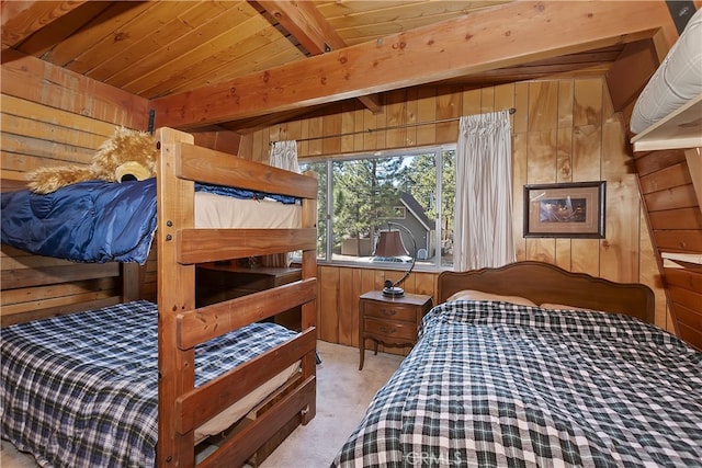 bedroom featuring light carpet, wood ceiling, wooden walls, and beam ceiling