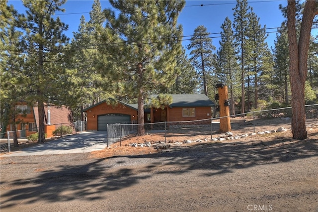 rustic home featuring a garage, fence, and a chimney