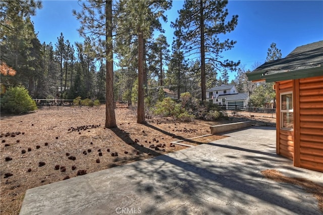 view of yard featuring a patio area and fence