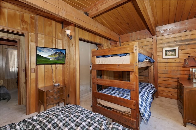 bedroom featuring wood ceiling, light colored carpet, beam ceiling, and wooden walls