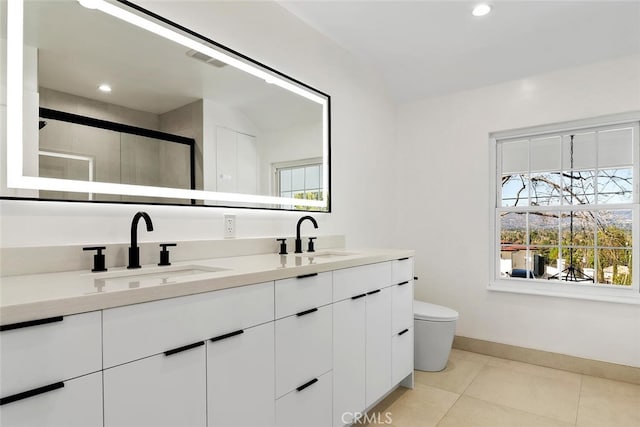 full bathroom with tile patterned flooring, visible vents, a sink, and double vanity