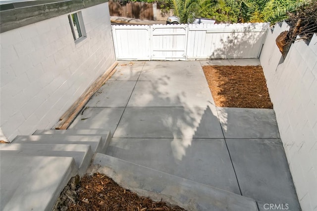 view of patio with a gate and a fenced backyard