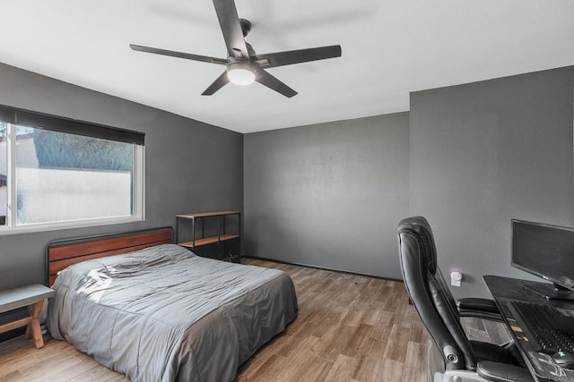 bedroom featuring ceiling fan and wood finished floors