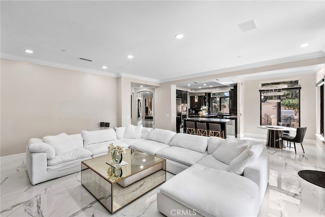 living area with recessed lighting, marble finish floor, crown molding, and arched walkways