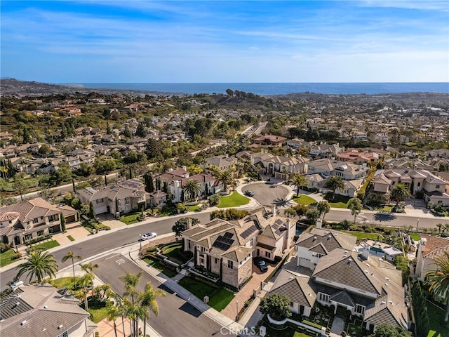 aerial view with a water view and a residential view