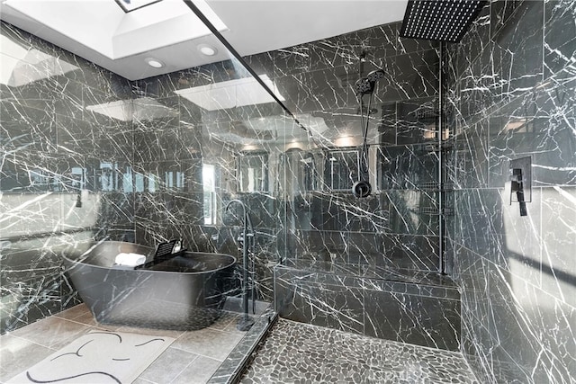 bathroom featuring a marble finish shower