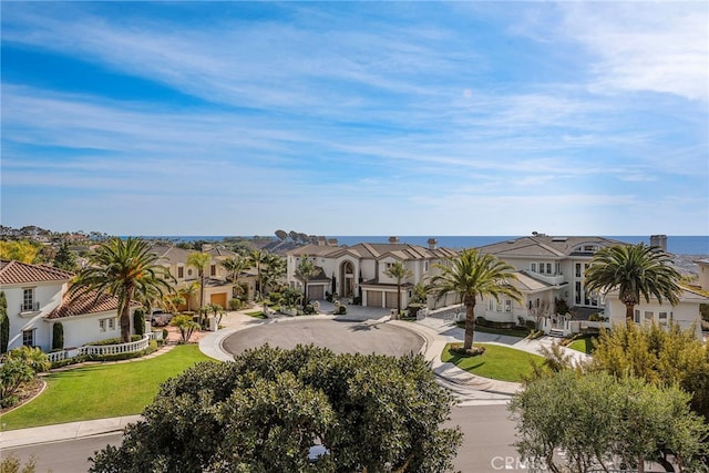 aerial view with a residential view and a water view