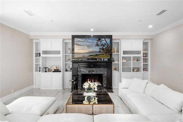 living room featuring a premium fireplace, visible vents, baseboards, marble finish floor, and crown molding