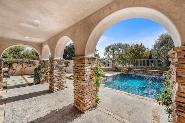 view of pool with a patio area, fence, and a fenced in pool