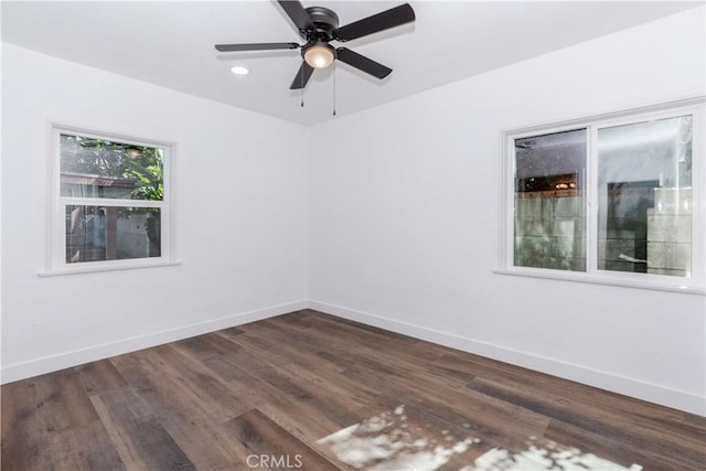 unfurnished room with dark wood-style floors, recessed lighting, baseboards, and a ceiling fan