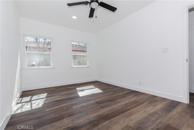 empty room featuring dark wood-type flooring, recessed lighting, ceiling fan, and baseboards