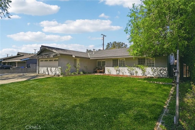 single story home with an attached garage, a front lawn, concrete driveway, and stucco siding