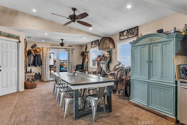 carpeted dining space featuring lofted ceiling, a textured ceiling, and recessed lighting