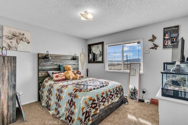 bedroom featuring a textured ceiling and baseboards