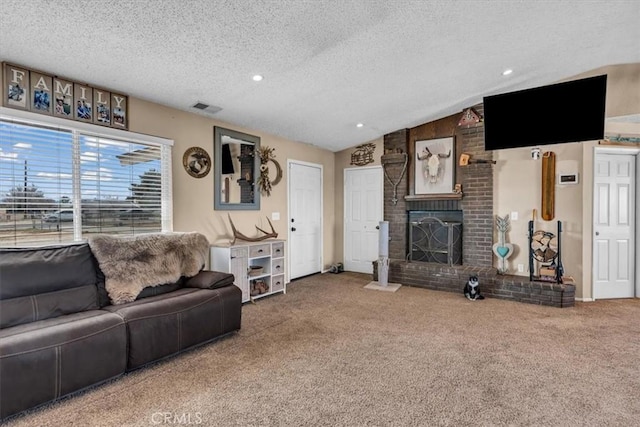 living room featuring vaulted ceiling, a brick fireplace, carpet flooring, and visible vents