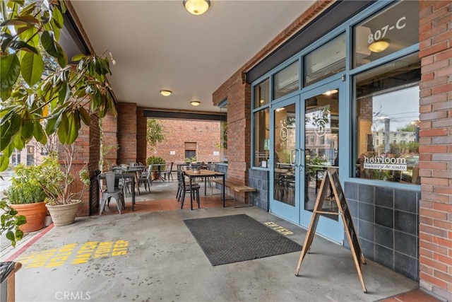 view of patio / terrace featuring french doors and outdoor dining area