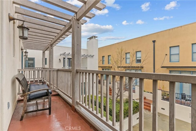 balcony featuring a pergola