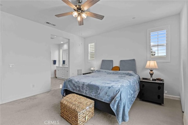 carpeted bedroom with baseboards, visible vents, multiple windows, and a ceiling fan