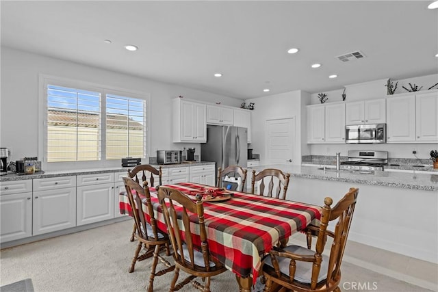 dining area with visible vents and recessed lighting
