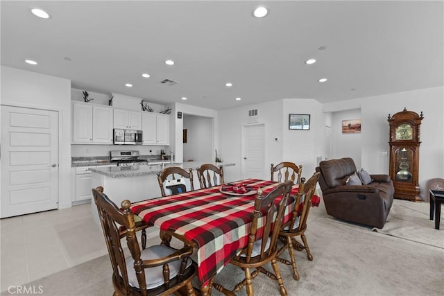 dining space featuring light tile patterned flooring, visible vents, and recessed lighting
