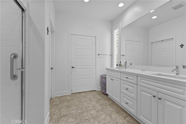 bathroom with recessed lighting, a sink, visible vents, double vanity, and tiled shower