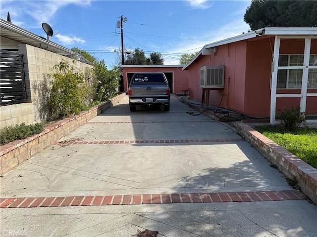 view of side of property with driveway