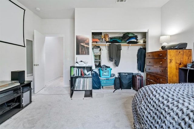 bedroom with a closet, carpet flooring, and visible vents